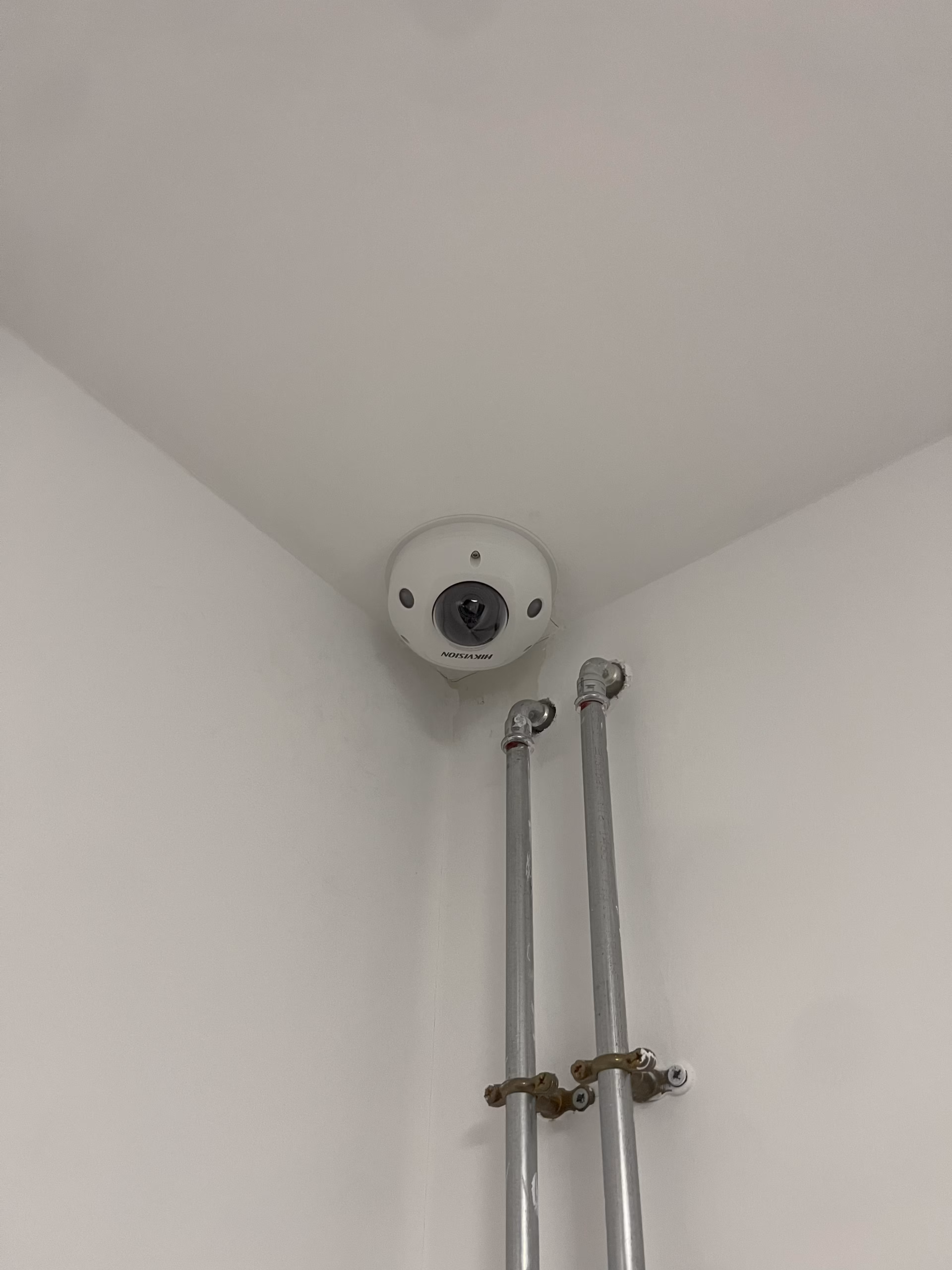 Hikvision mini dome camera installed in a Brunswick House corridor
